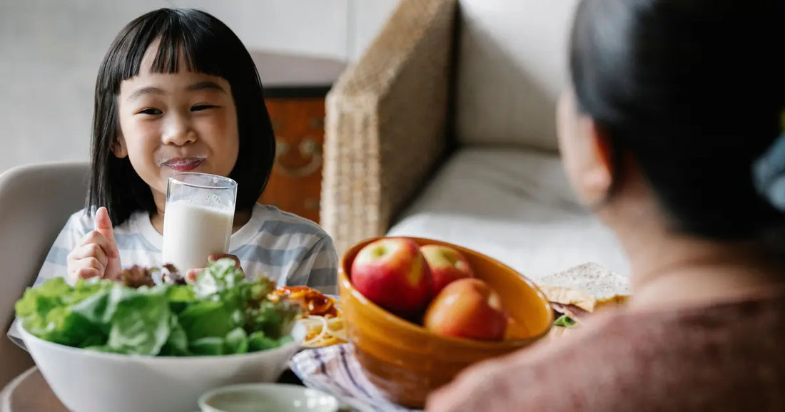 Child drinking milk for calcium and healthy bone development